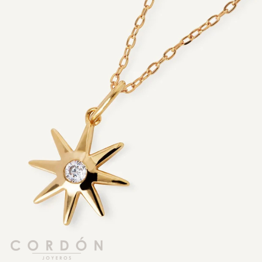 Detalle del colgante en forma de sol con circonita central Vidal Vidal X7838340